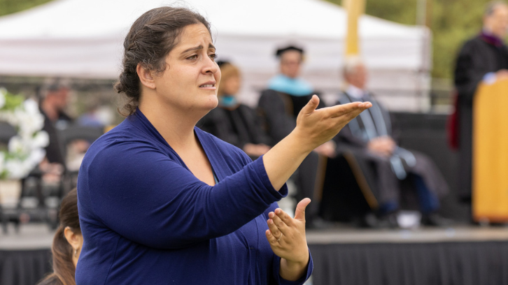 An ASL interpreter provides interpretation services during the 2023 Commencement.