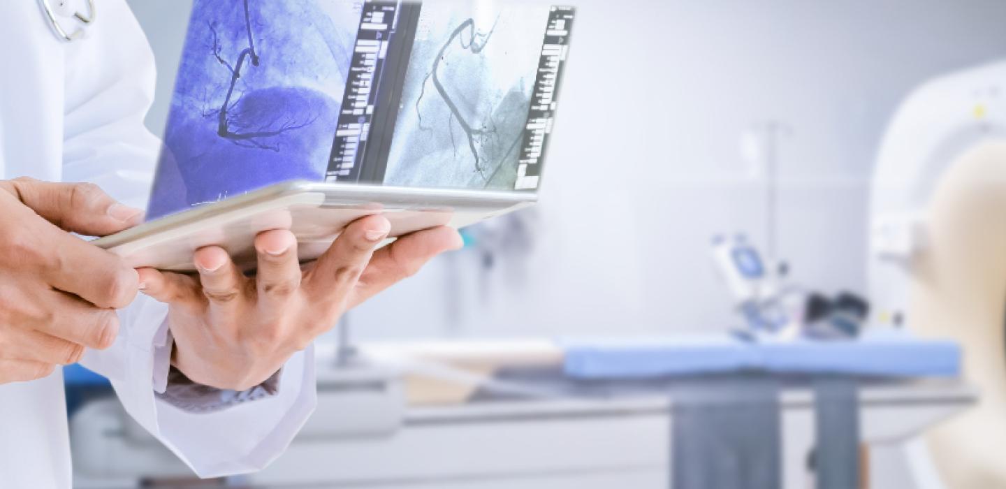 x-ray technician with MRI machine in the background