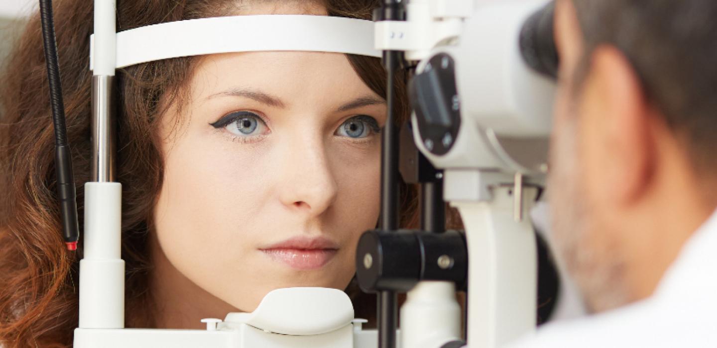 optical technician performing an eye exam