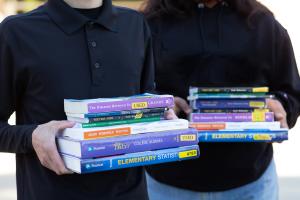 Students holding textbooks