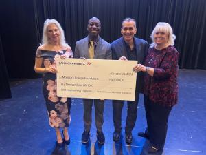 Debi Klein, President Julius Sokenu, Ed Garcia, and Jill Haney hold a large check for $50,000 from Bank of America awarded to the Moorpark College Foundation